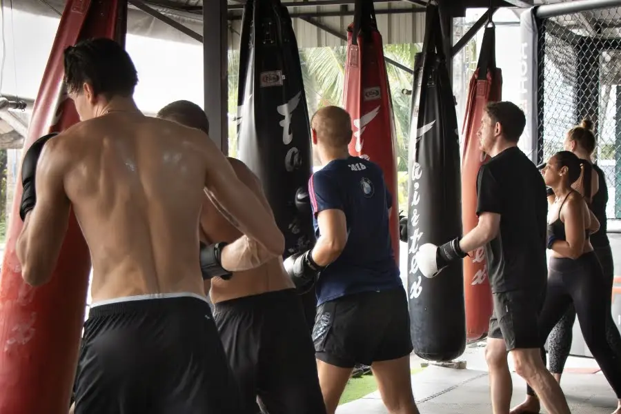 People on kick bags in muay thai group class at BXB Fight Lab in Koh Samui